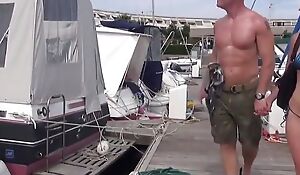 Sailing-boat day for a swinger couple with a man banging a young stunning blonde while his wife is watching