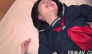 Delightsome japanese chick gives vibrant beak sucking