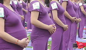 Pregnant Asian women doing yoga (non porn)