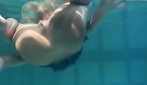 Blonde Feher with big firm chest underwater