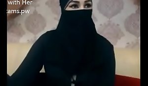 Indian Muslim girl in hijab adhere to chatting on webcam