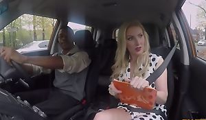 Busty driving school instructor pleasuring black clothes-horse in the car