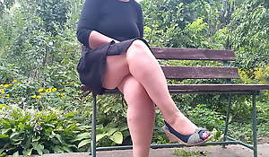 Lustful MILF peeing while sitting heavens a bench